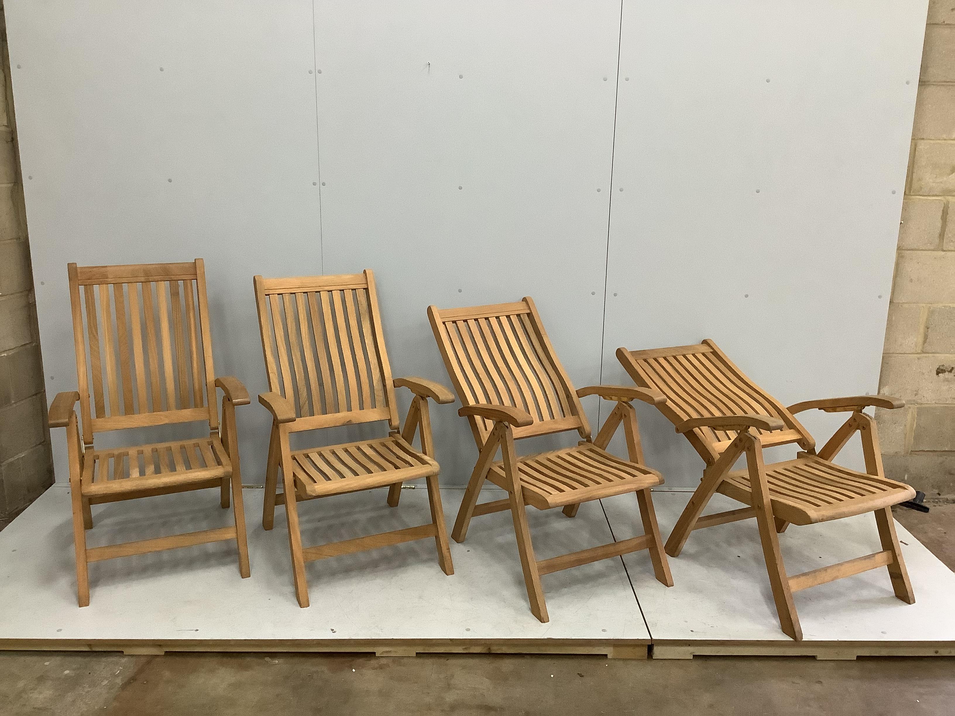 A set of four 'Canterbury Collection' brass mounted teak folding garden armchairs, width 62cm, height 104cm